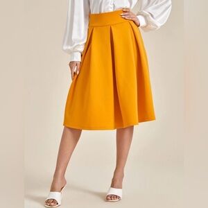 Women's Pleated A-Line Midi Skirt in Mustard Yellow